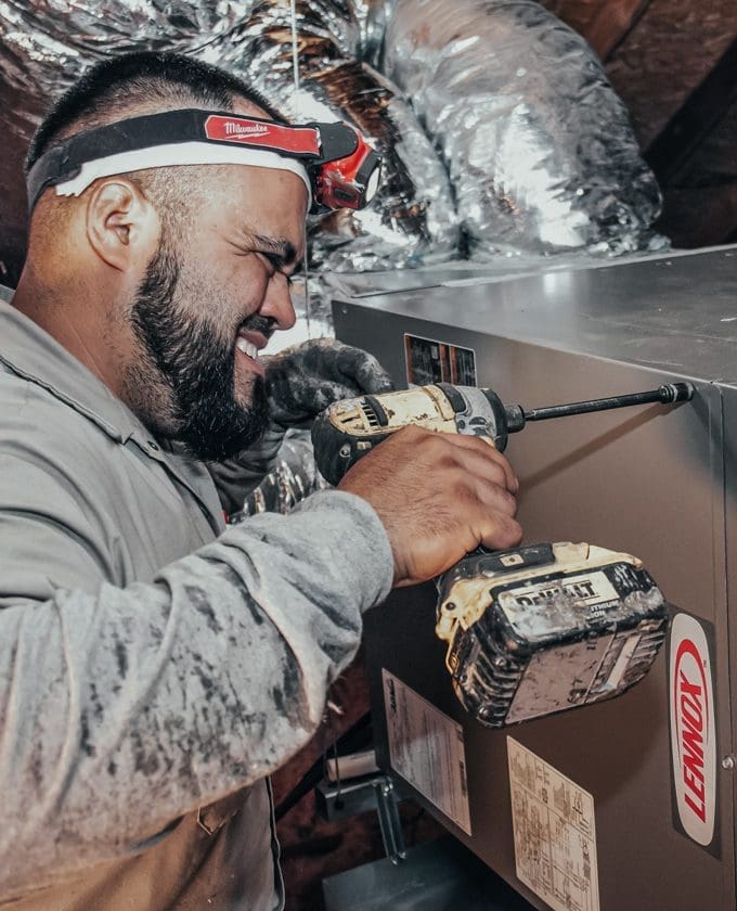 HVAC technician installing a new HVAC unit